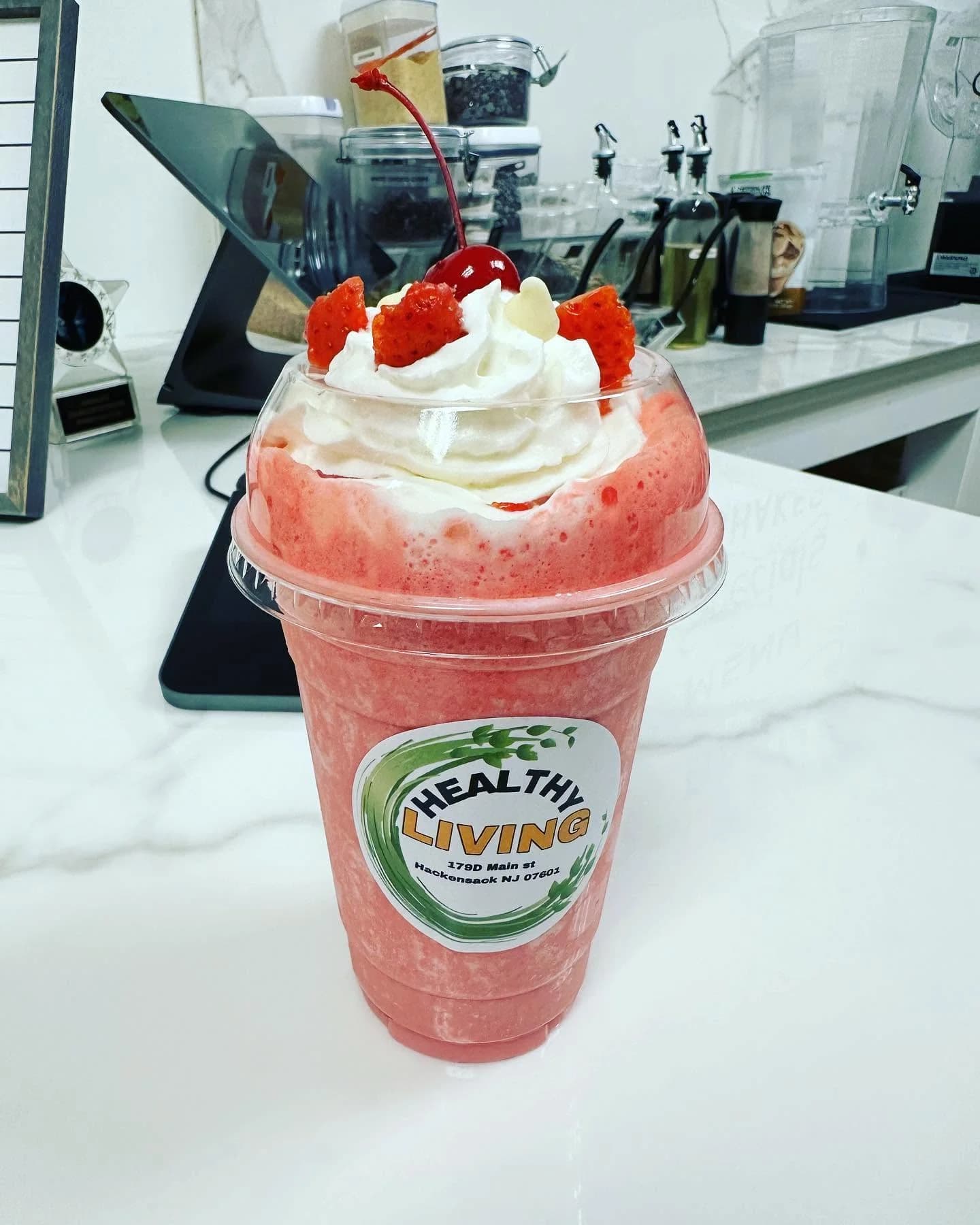 Strawberry protein shake topped with whipped cream